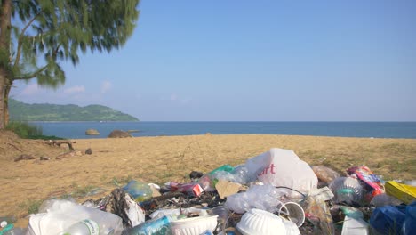 plastic trash in idyllic beach scene