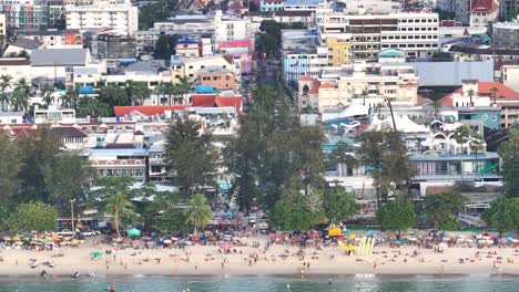 patong town with promenade and main street, aerial close up. phuket, thailand. cityscape