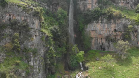 drone footage flying downward a water fall in old akkar