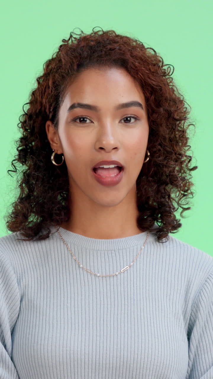 Happy Young Woman Winking and Smiling on Green Screen