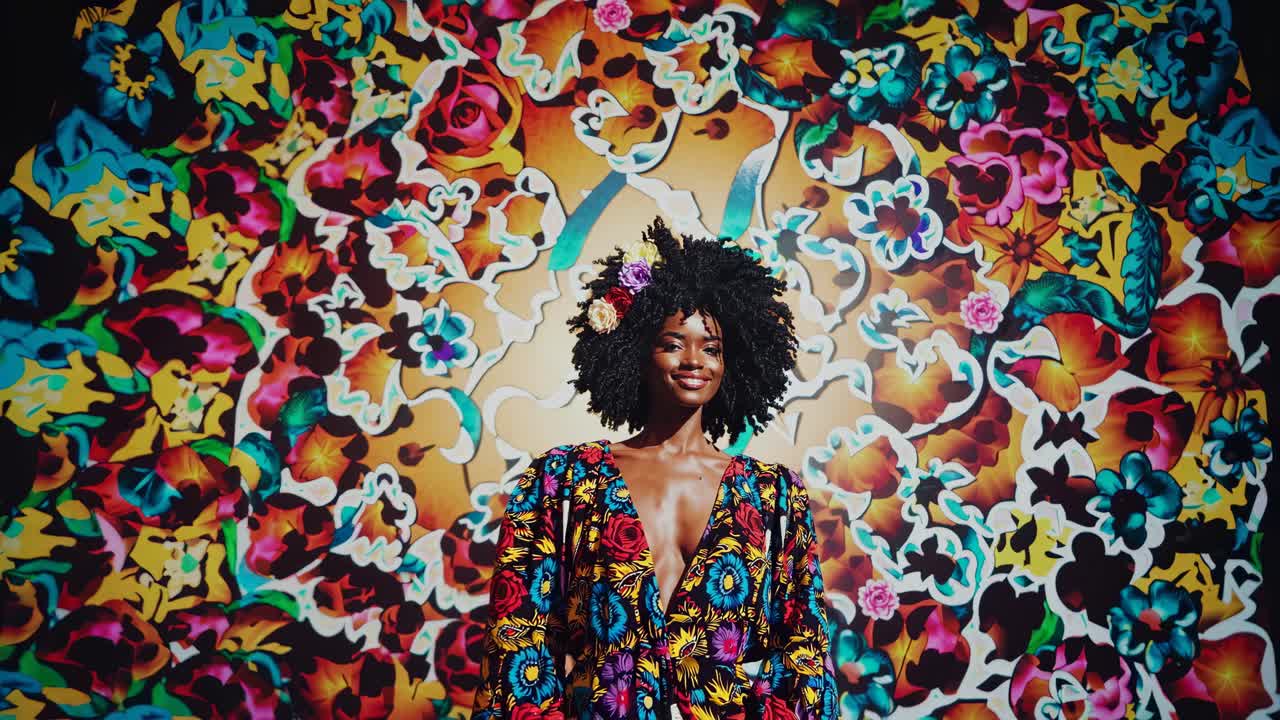 Vibrant video concept with a woman in floral attire, surrounded by colorful patterns