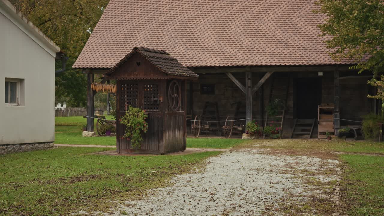 Old Wooden House and Barn in a Rural Setting