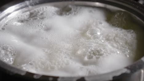 boiling potatoes in boiling hot water, fried roasted potatoes for dinner