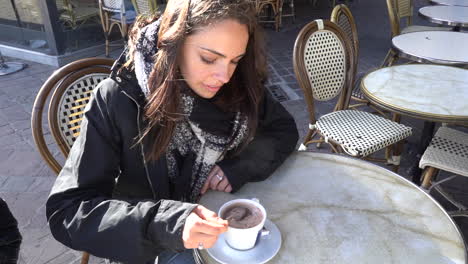 woman stir her hot chocolate