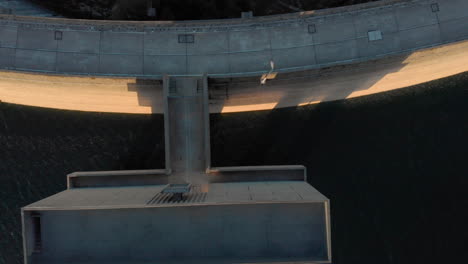 dam wall dramatic light birdseye dolly reveal depth on lake barragem do alto rabagao montalegre