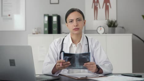 Indian-female-doctor-explaining-X-ray-report-to-patient