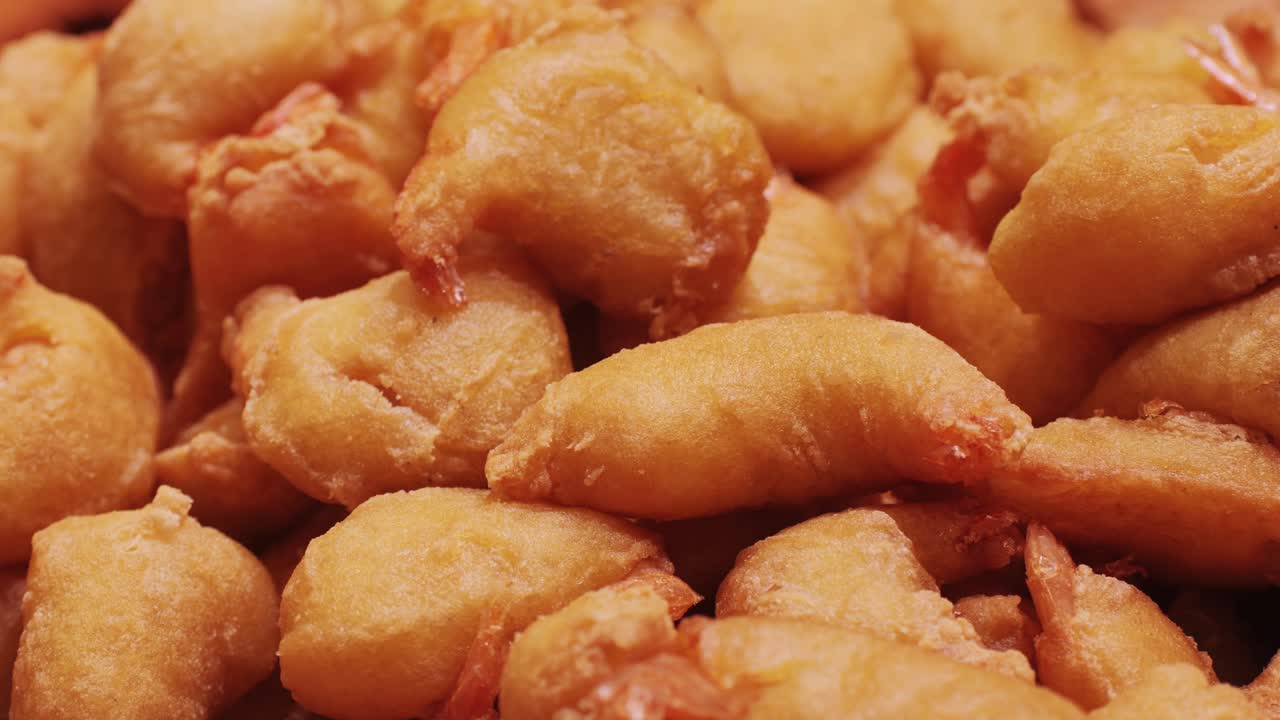 Enjoy these crispy, golden fried shrimp, perfect as appetizers or delightful snacksirresistible choice