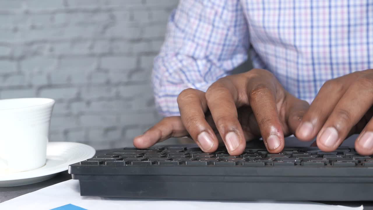 Person Typing on a Computer Keyboard