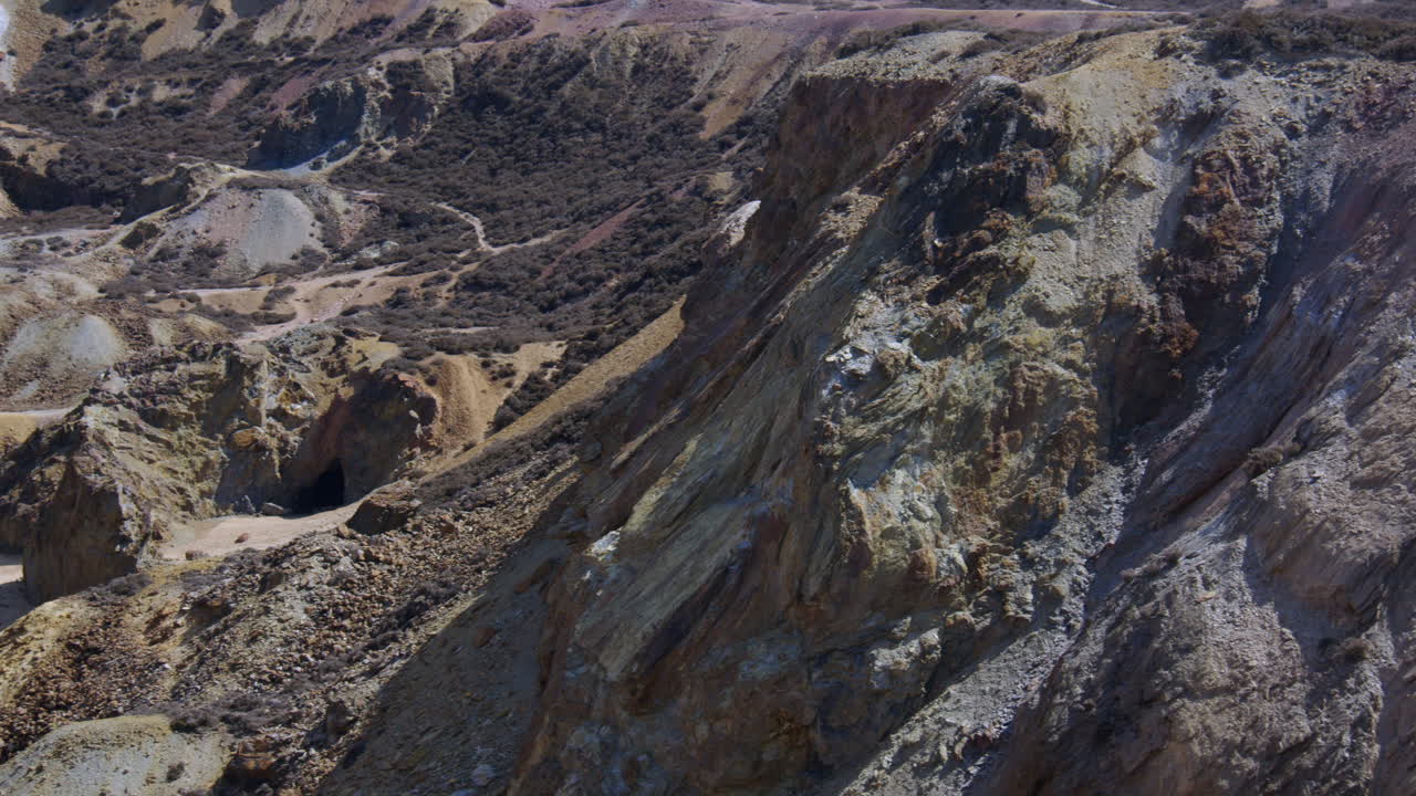 Wide panning shot looking up the Great opencast mine at mynydd parys mountain copper mine