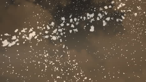 animation of shooting star and stars falling over clouds on brown background