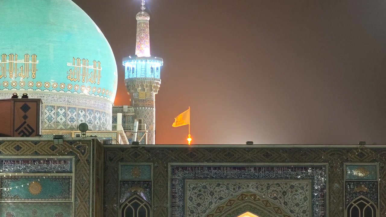 Illuminated Mosque Dome and Minaret at Night