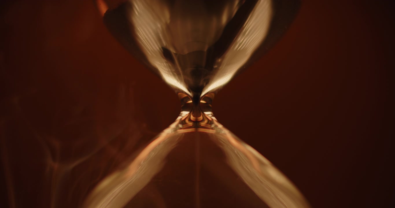 Abstract hourglass on golden background