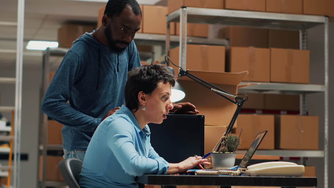 Two people working in a warehouse