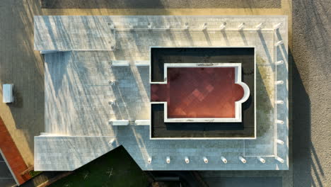 ancient roman temple replica in tongeren, belgium - aerial overhead riser