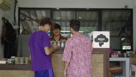 customers at a cannabis dispensary counter