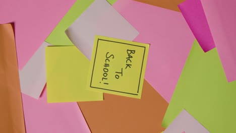 education concept of revolving sticky notes with back to school written on top note