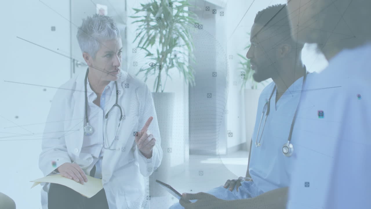 Senior doctor and colleague discussing data in hospital lounge, showing animated health charts