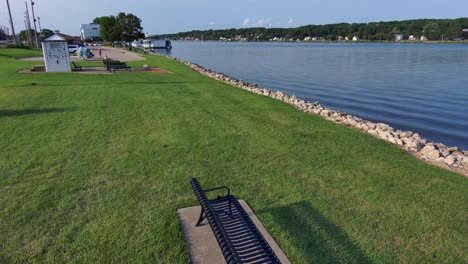 A-backward-reveal-of-a-park-bench-looking-out-over-the-Mighty-Mississippi-river-in-Iowa