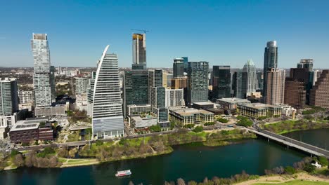 Aerial-shot-of-downtown-Austin,-TX-with-the-Colorado-River-in-frame