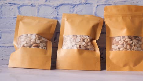 peeled peanuts in a paper packet on table