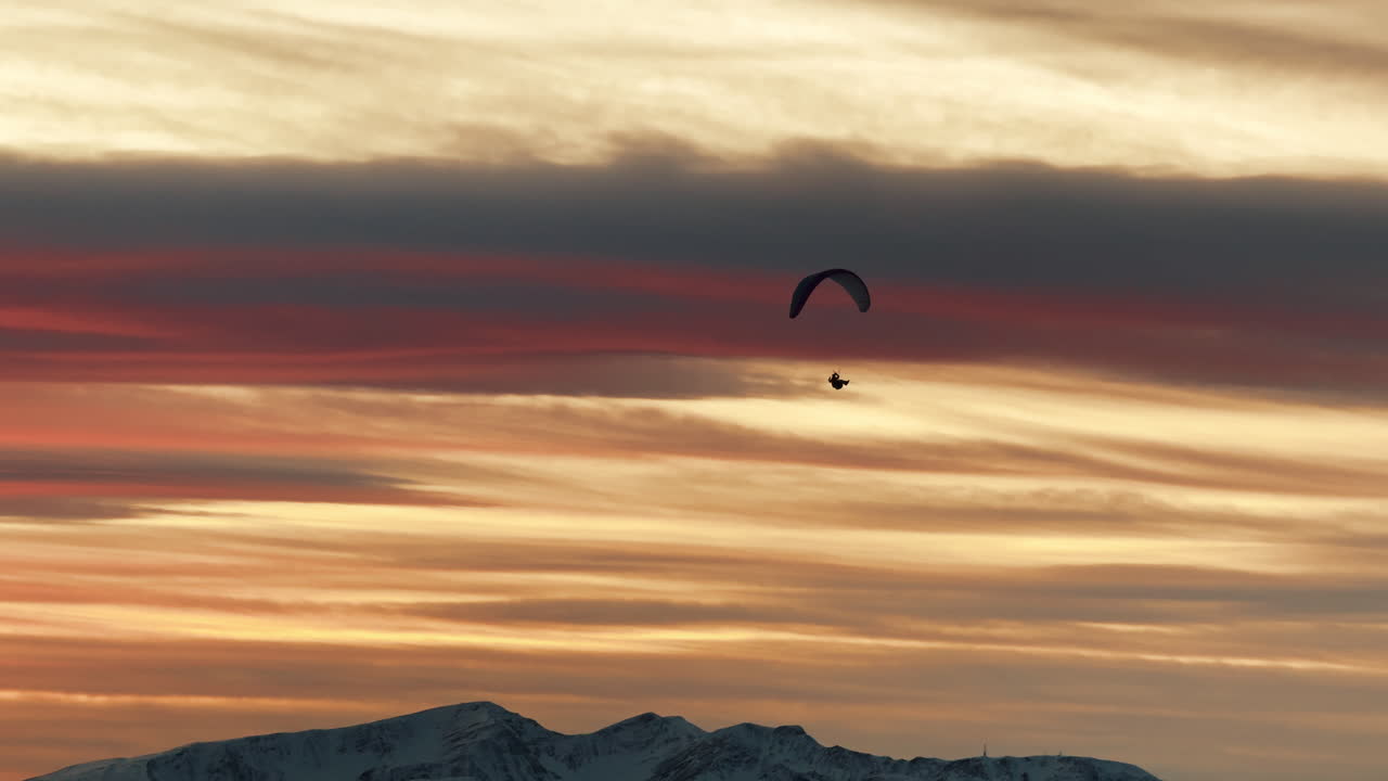 Paragliding at Sunset over Mountains