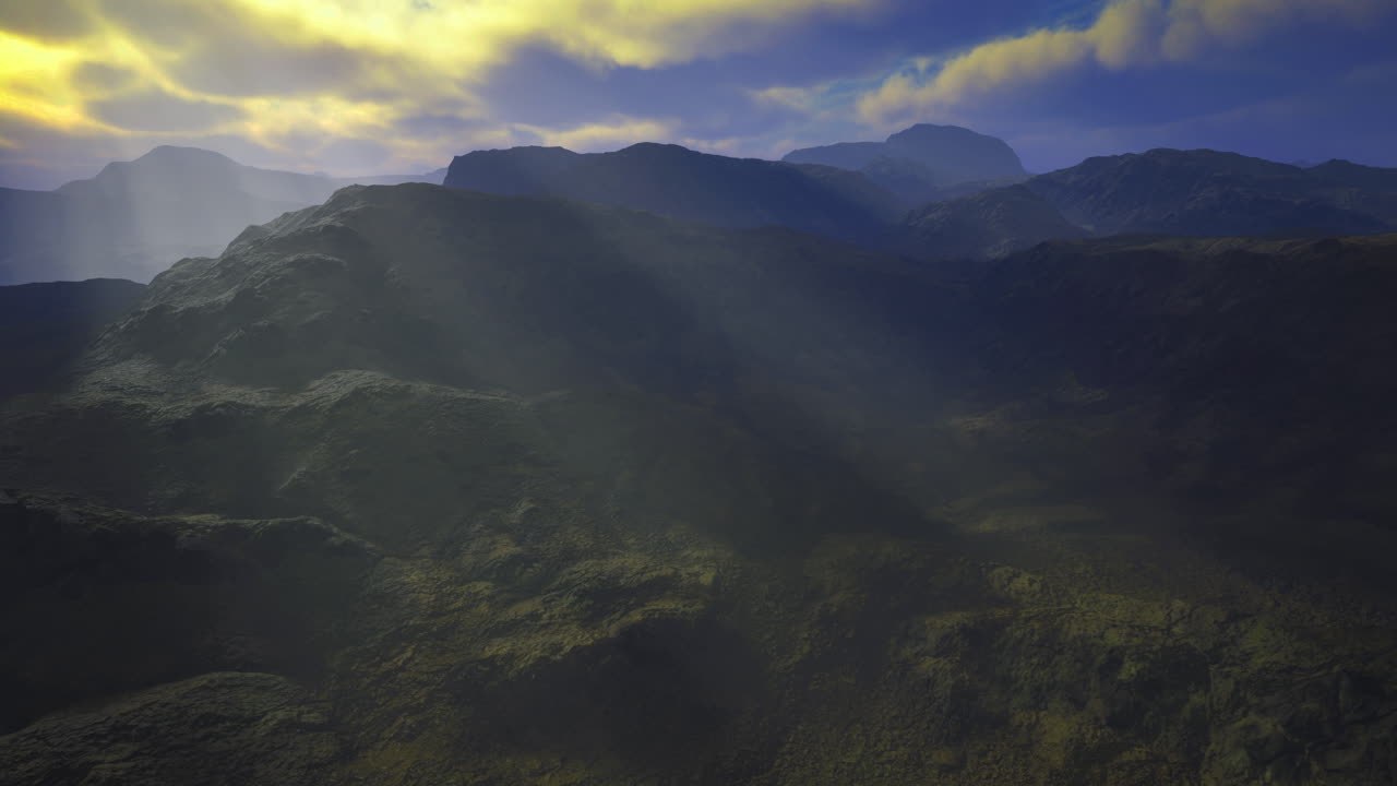 Majestic mountains with sunlight streaming over ridges at twilight