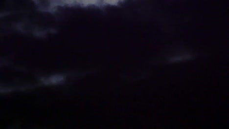 the moon being covered by clouds.