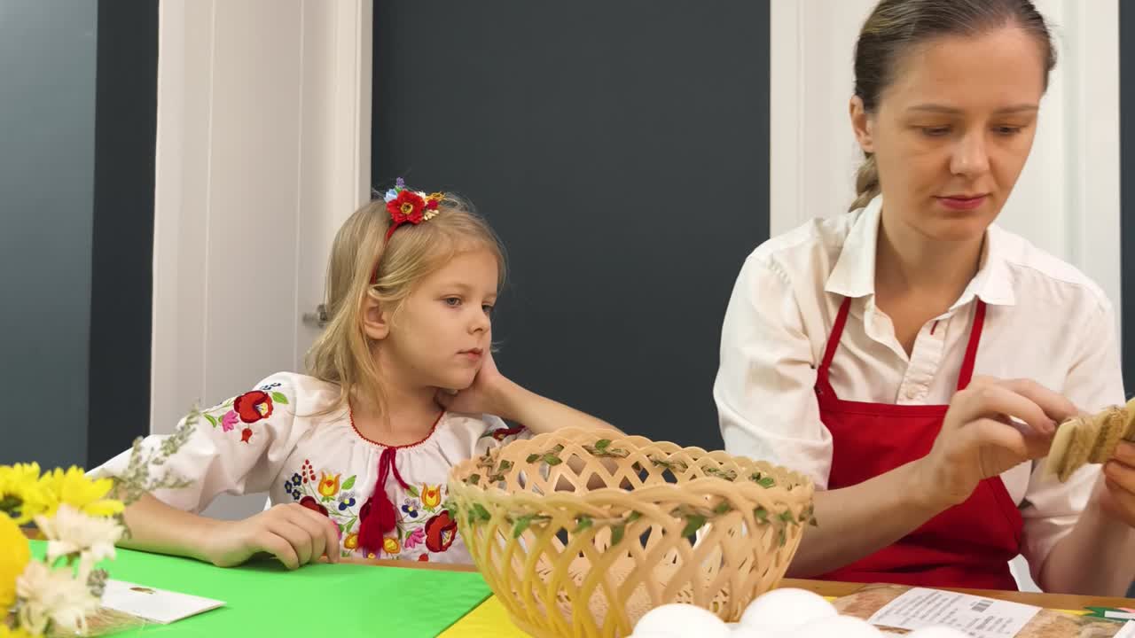 Mother and Daughter Decorating Easter Eggs