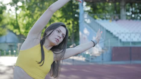 woman jogging on outdoor track in sportswear at athletic field