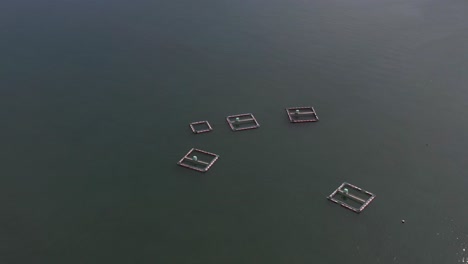 Dolphin-Sea-Cages-and-Seaside-Dolphinarium-in-Japan,-Aerial-View