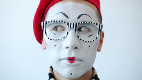 mime with red beret and striped glasses