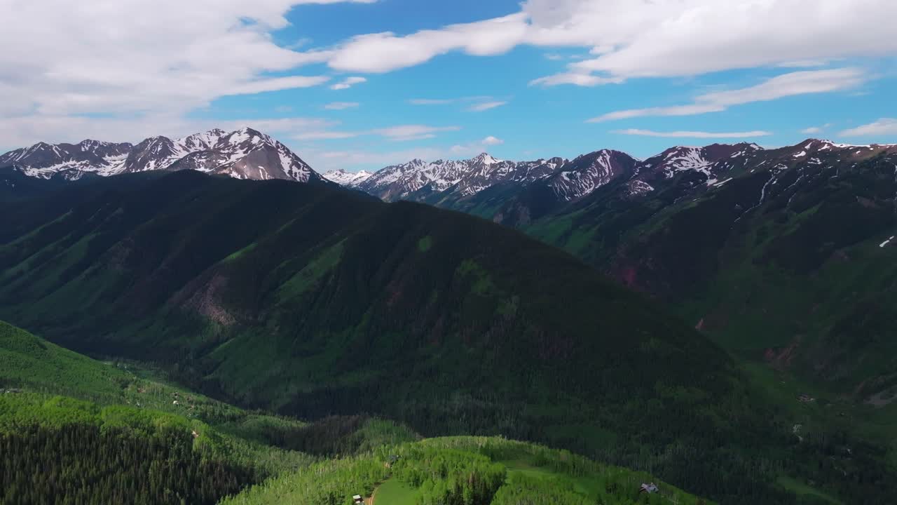 Aspen Mountain Ajax Little Annie Trailhead aerial drone Colorado Conundrum creek trail Castle Peak 14er Rocky Mountains Elk Range Aspen Trees spring summer morning blue sky clouds forward pan up