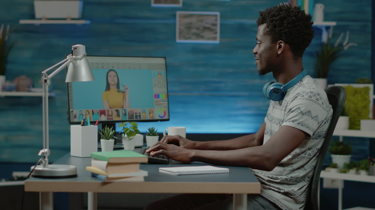 African american photographer retouching pictures on computer