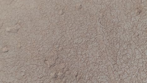 drone birds eye view clip showing dry and cracked earth in western australian outback