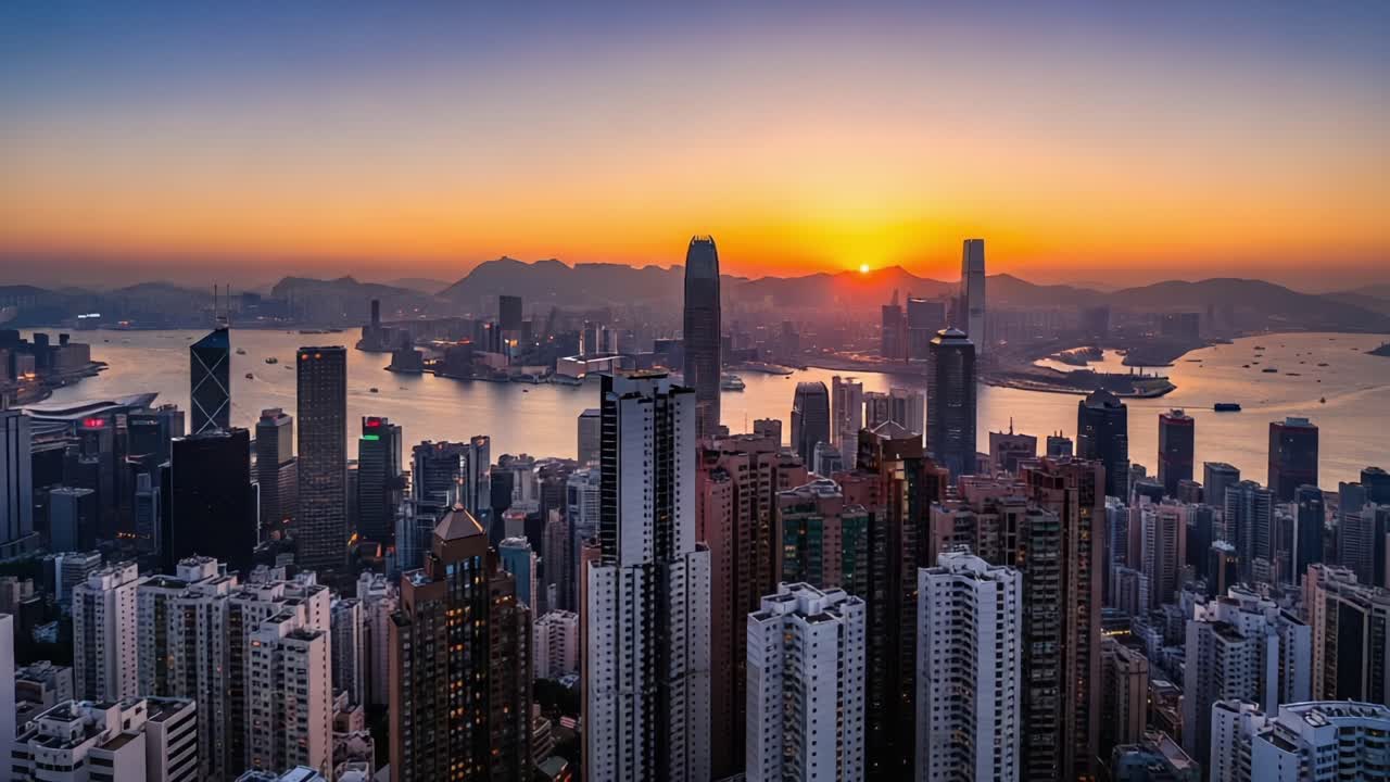 Stunning Cityscape at Sunset: A Breathtaking View of Urban Skyline Reflected in Tranquil Waters Surrounded by Majestic Mountains and a Colorful Sky