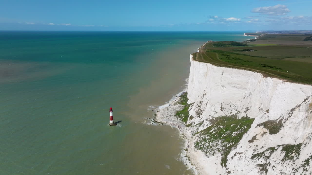 Beachy Head Lighthouse And Seven Sisters Cliffs In Eastbourne, Sussex, United Kingdom. - aerial shot