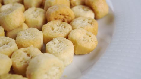 round baked rough crispy croutons on a white plate. bread rusks