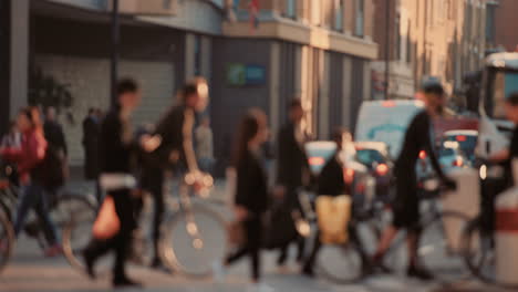 Anonymous-crowd-of-people-walking-cycling-bicycles-commuters-London-City-street-slow-motion