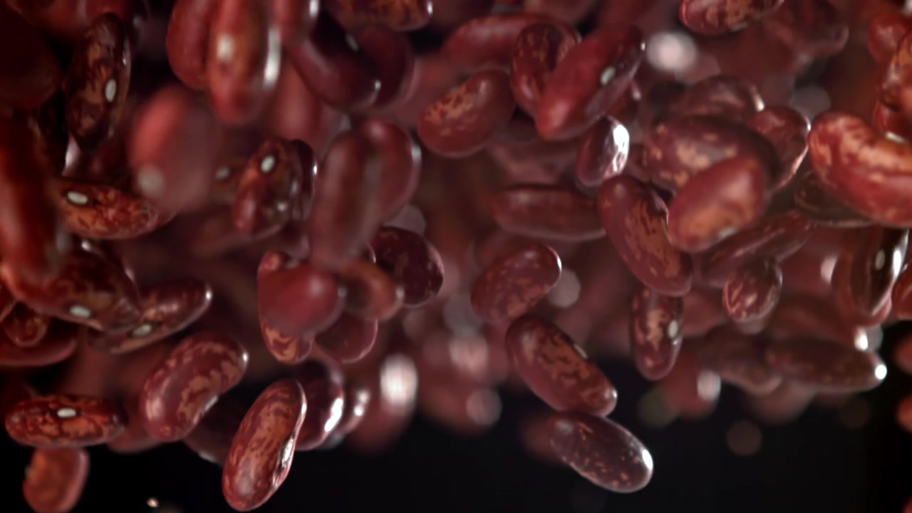 Red Kidney Beans Falling in Slow Motion on Black Background