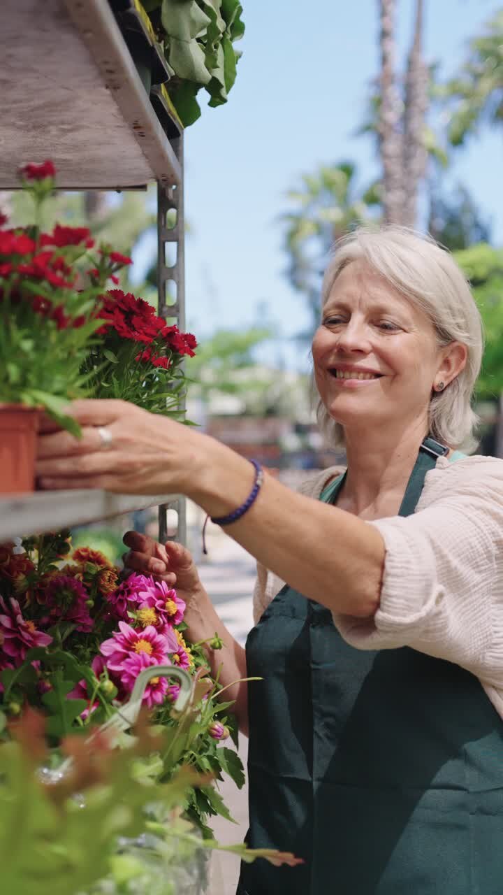 Senior Woman Selecting Flowers at a Nursery