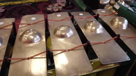 closeup of javanese gamelan musical percussion bronze instruments, indonesia