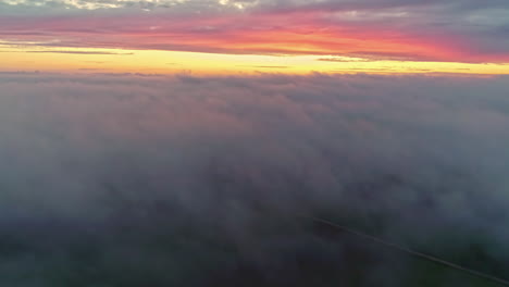 sunset above misty cloud at the horizon of sky