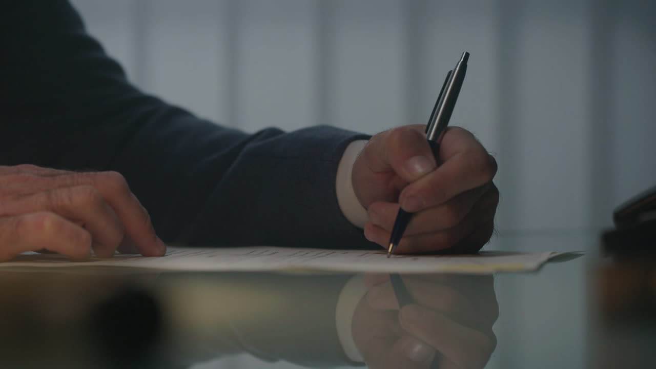 Man Signing a Document