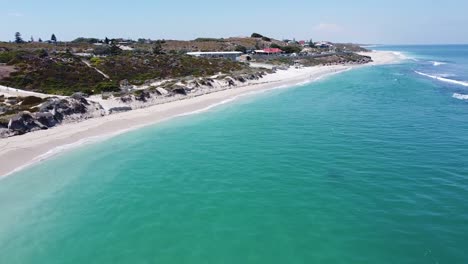 People-on-the-beach-and-in-the-water-at-Yanchep-Lagoon,-Perth,-Australia