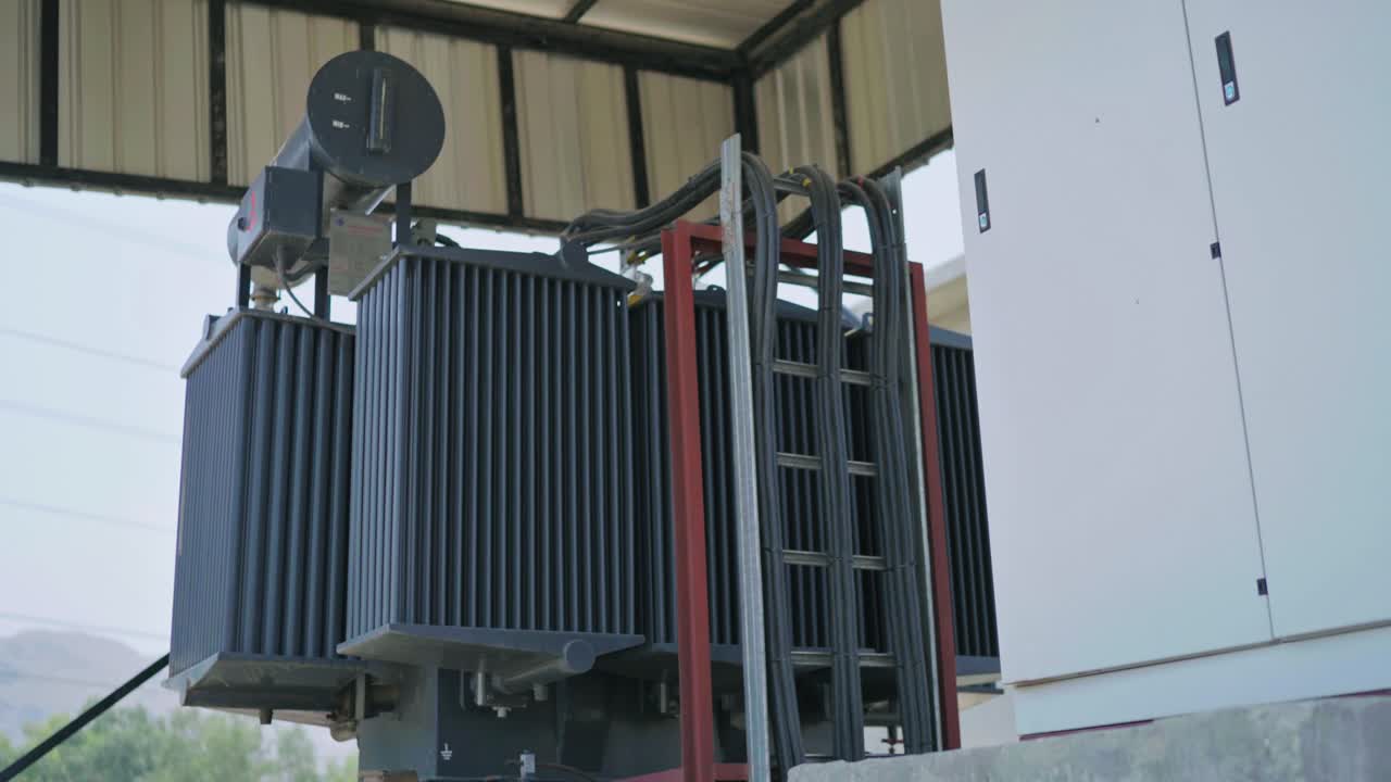 Profile view of a transformer of an industry. Day view