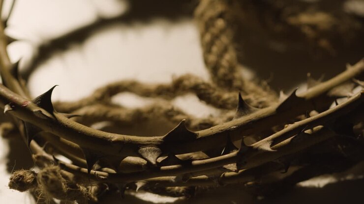Religious Concept Shot With Close Up Of Crown Of Thorns And Rope