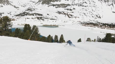 skiing girl showing fast long ski turns on a beautiful ski slope in a ski resort in austria tirol