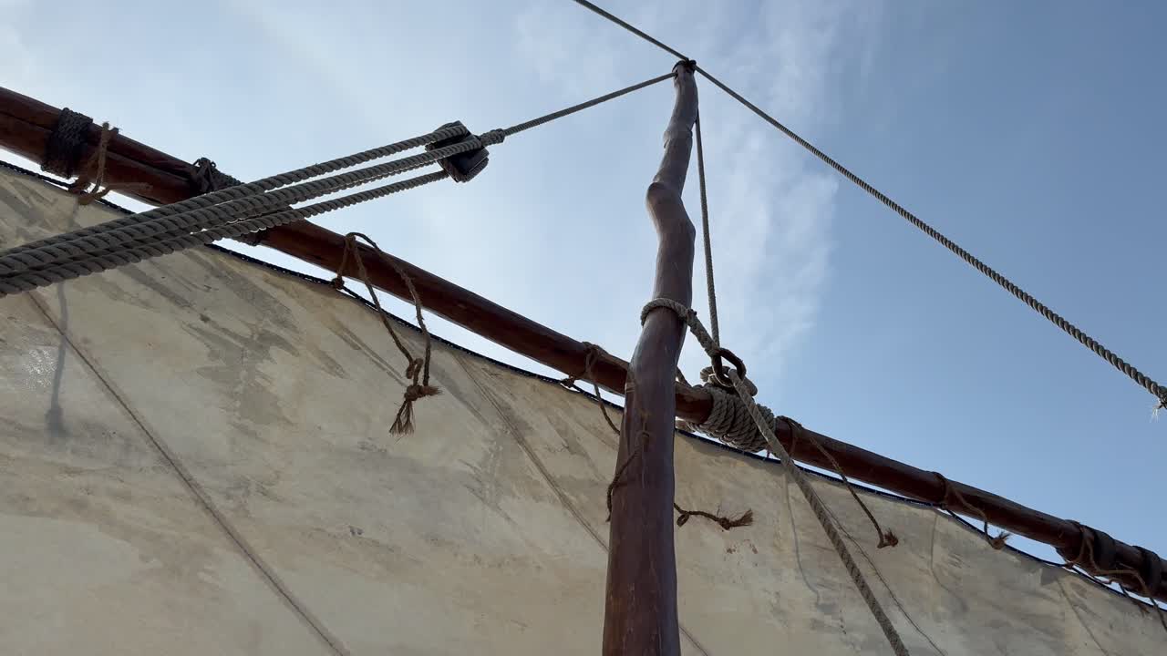 Dropping the sail of Traditional Zanzibar Dhow boat in Zanzibar, Tanzania