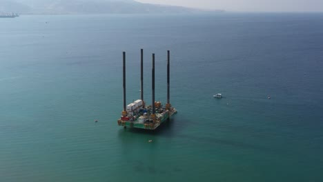 Jack-Up-Oil-and-Gas-Rig-in-the-Sea,-Offshore-oil-and-Gas-processing-Platform,-industry-Equipment---Orbiting-view