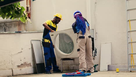 Experts-working-on-air-conditioner